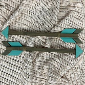 Wood and blue wall decor arrows